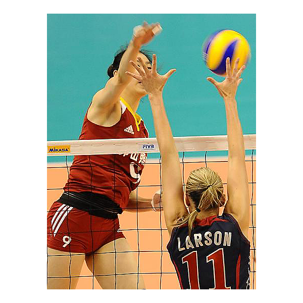 Jordan Larson putting up block against China